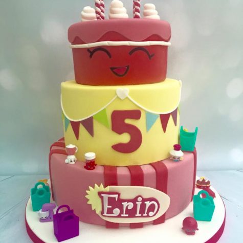 A bespoke 3 tier 'Shopkins' themed birthday cake, shown as a 10" 8" and 6"