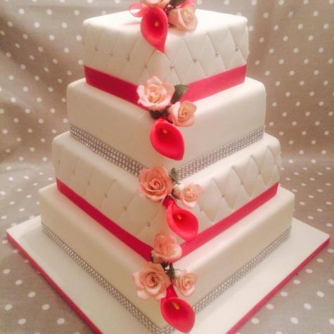Our latest wedding cake creation....a stunning 4 tier cake with a patchwork quilting effect with handmade cala lily and roses