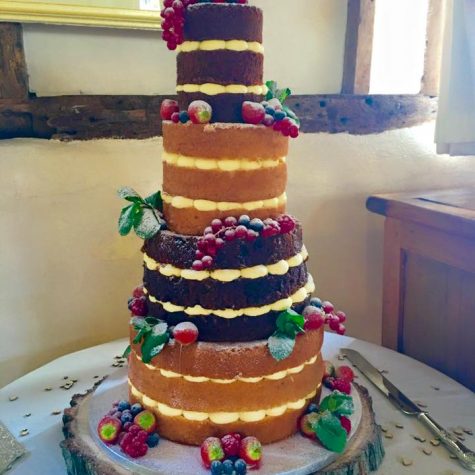 A 4 tier, triple layer naked wedding cake, made in vanilla, carrot, lemon and chocolate sponge. Shown as a 10", 8", 6" and 4" round