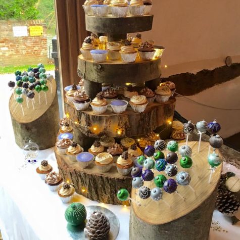 A winter wonderland cupcake table for a December wedding - featuring salted caramel, luxury lemon and chocolate fudge cupcakes with handmade toppers